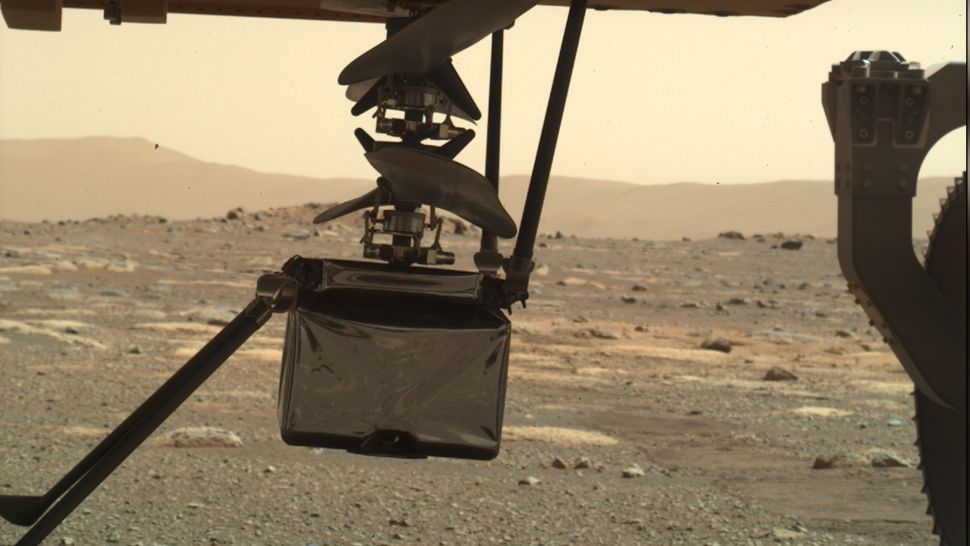 The Mars Helicopter Has Lowered All Four Legs and Is In Position to Touch Down On the Martian Surface